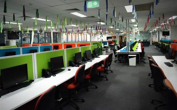 Premium reception area with marble flooring, slate blue accent wall, and contemporary furniture