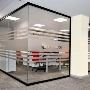 Bright lounge area with comfortable sofas, greenery, and natural light creating a relaxed collaborative space